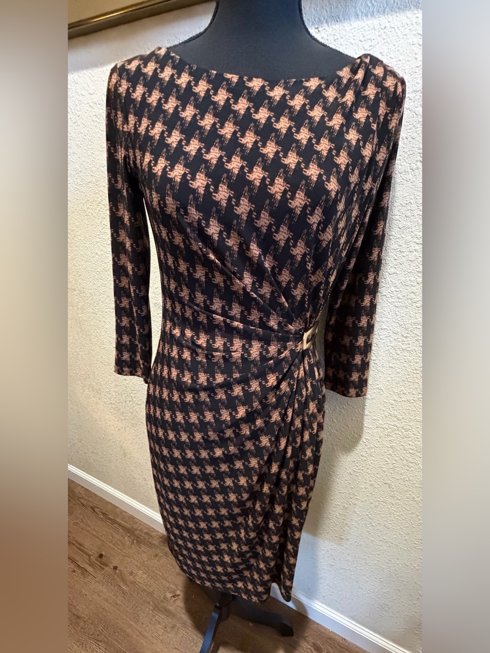 Women’s Black and Tan Houndstooth Wrap Sheath Dress with gold metal accent.